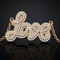 LOVE script diamond pendant in yellow gold — design visualization